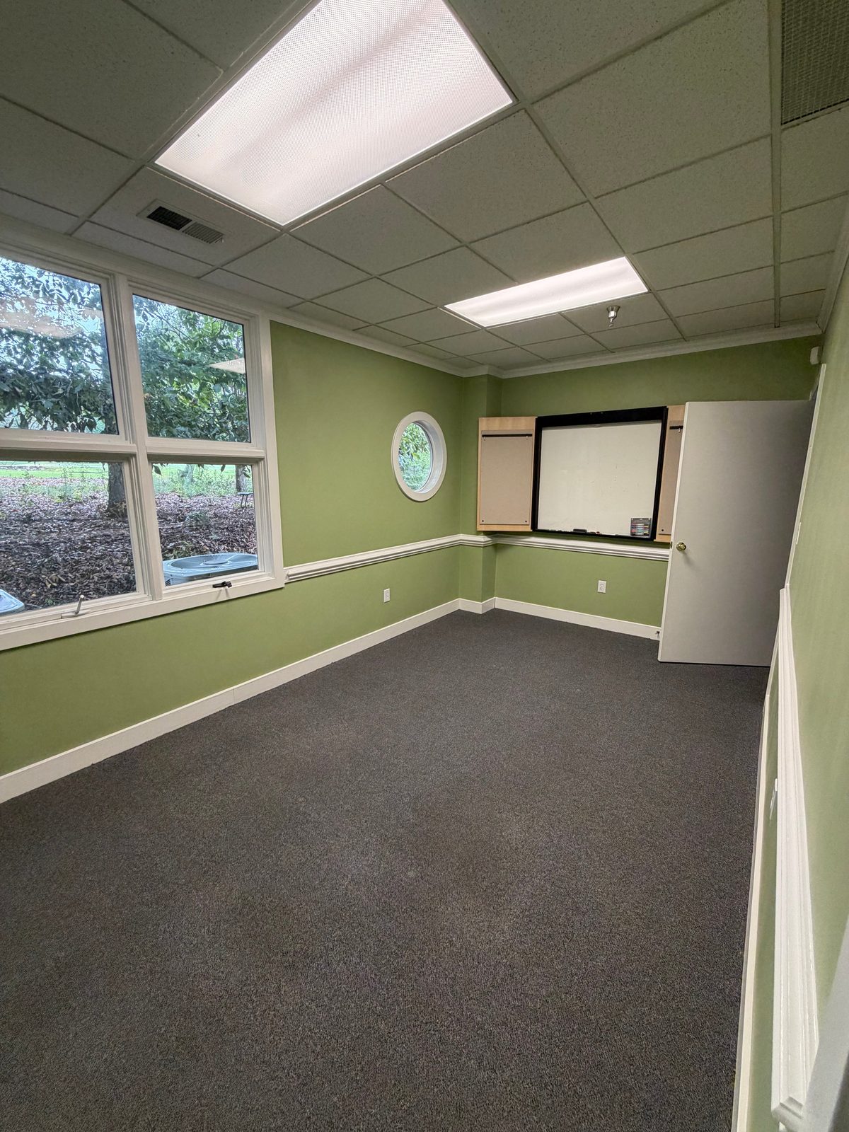 Spacious back office in Suite 205 with large windows overlooking the Croasdaile golf course