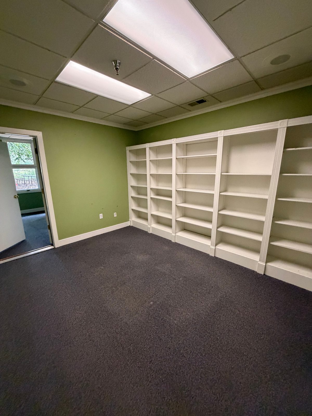 Private office in Suite 205 with wall-to-wall built-in bookshelves